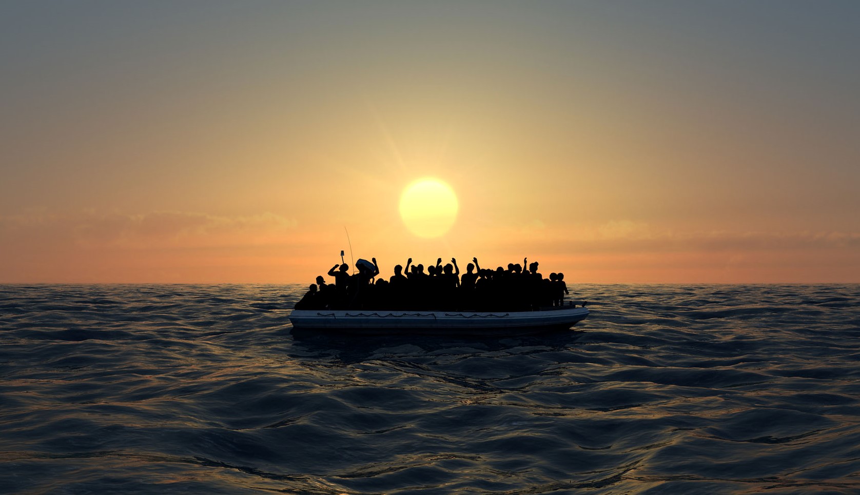 Refugees on a big rubber boat in the middle of the sea that require help